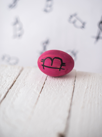 Bitcoin eggs on a wooden blurred background.の写真素材