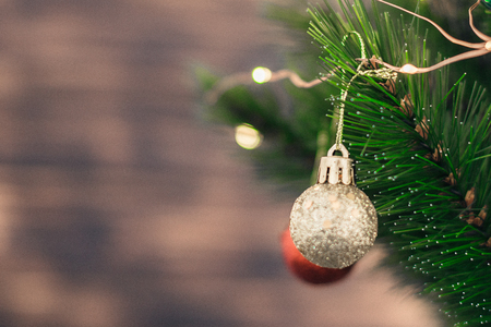 Christmas decorations on the tree with blurred background.の写真素材