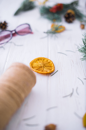 Dry orange on a white wooden background. New Year's concept.の写真素材