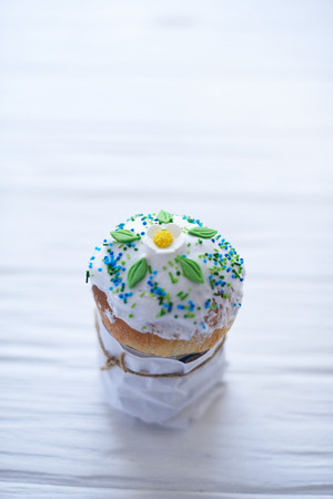 Easter cake on a white wooden background.の写真素材