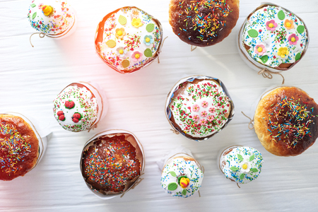 Easter cakes on a white wooden background.の写真素材