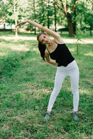 Girl athlete on the nature of yoga.の写真素材