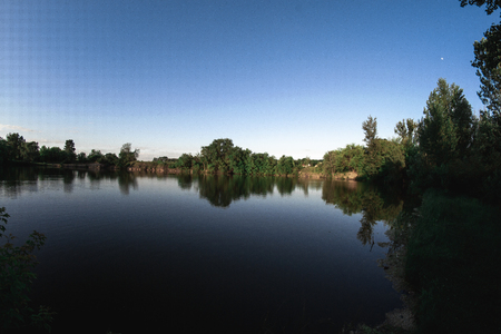 Evening summer landscape on the pond.の写真素材