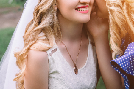 Bride in a white dress with a girlfriend in nature. hen-party.の写真素材