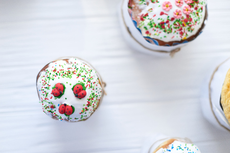 Easter cakes on a white wooden background.の写真素材