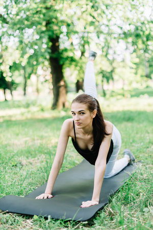 Young beautiful girl doing yoga in nature.の写真素材