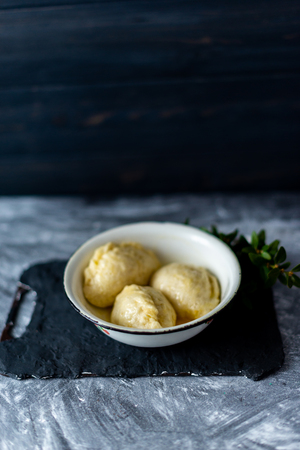 Ready meal - dumplings on a black cement background.の写真素材