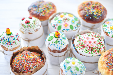 Easter cakes on a white wooden background.の写真素材