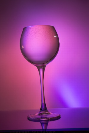 Glass of water on a colored background.の写真素材