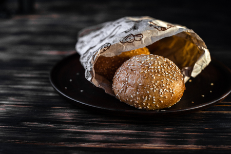 Burger buns on a black background.の写真素材