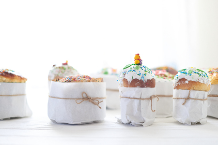 Easter cakes on a white wooden background.の写真素材