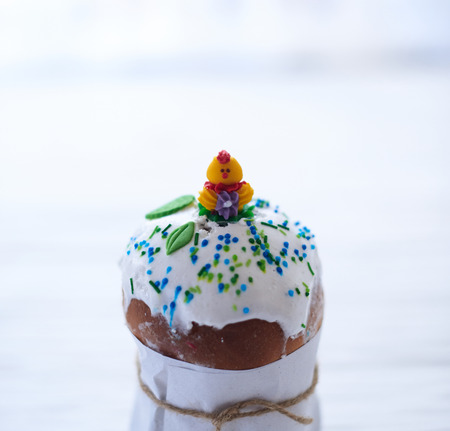 Easter cake on a white wooden background.の写真素材