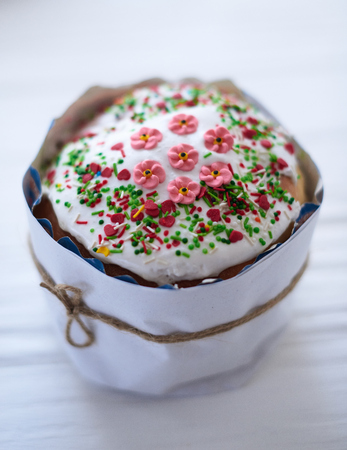 Easter cake on a white wooden background.