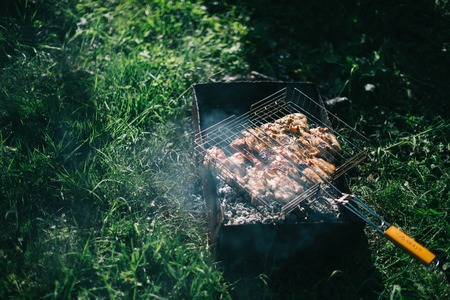 Barbecue on a summer day in the garden. Picnic outdoor recreation concept.の写真素材