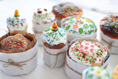 Easter cakes on a white wooden background.の写真素材