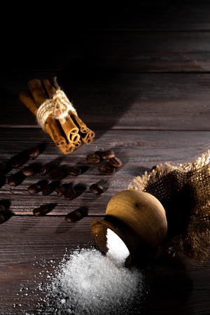Small barrel with sugar on a wooden background.の写真素材