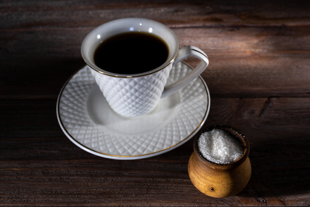 Cup of coffee on a dark wooden background.の写真素材