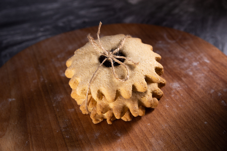 Tied homemade cookies in a stack. With blurred background.の写真素材