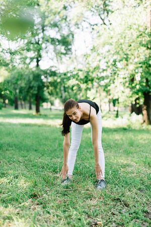 Girl athlete on the nature of yoga.の写真素材