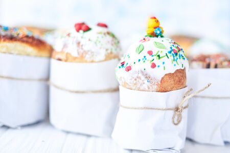 Easter cakes on a white wooden background.の写真素材