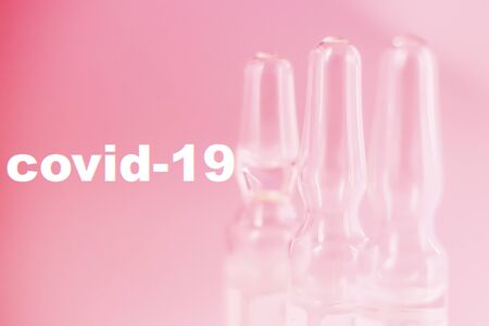 Coronavirus vaccine macro ampoule concept. Blurred background photo.の写真素材