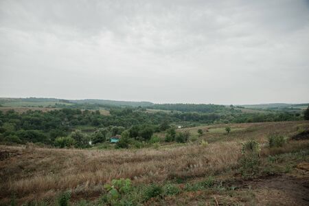 Summer landscape on a cloudy rainy day in nature.の写真素材