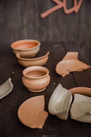 Handmade clay brown pots with blurry background.の写真素材