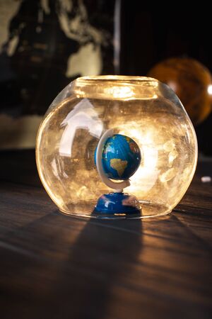 Earth under a glass bell. Quarantine, pandemic concept in the world COVID-19.の写真素材