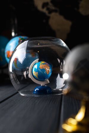 Earth under a glass bell. Quarantine, pandemic concept in the world COVID-19.の写真素材