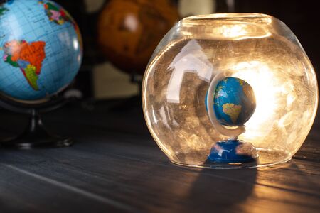 Earth under a glass bell. Quarantine, pandemic concept in the world COVID-19.の写真素材