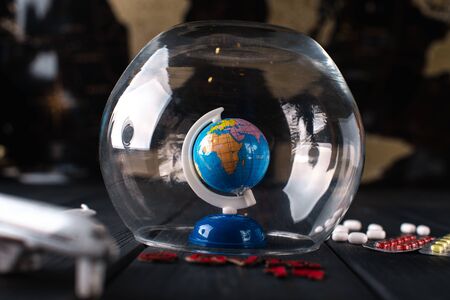 Earth under a glass bell. Quarantine, pandemic concept in the world COVID-19.の写真素材