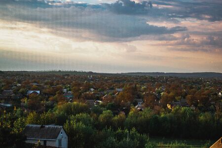 Spring evening landscape outside the city before the rain.の写真素材