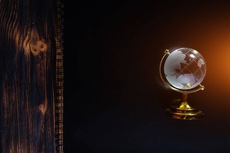 Glass globe on a black matte background.の写真素材
