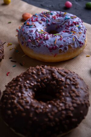 Donuts on a wooden board on a blue concrete background.の写真素材