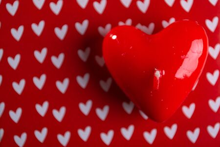 Red scented candles hearts on a black background.