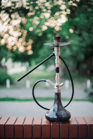 Metal hookah on a summer terrace with a blurred background.の写真素材