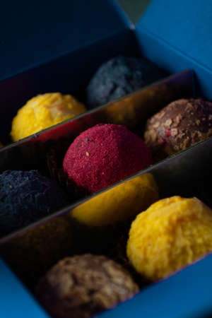 Colored round candies on a dark background.の写真素材