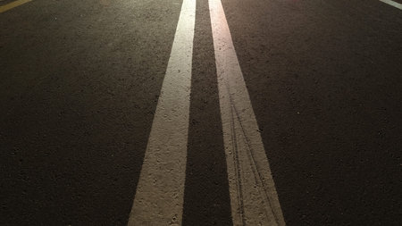 Asphalt bike path with markings at night