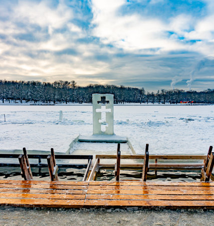 Ice sculpture in the shape of a cross next to the baptismal immersion fontの写真素材