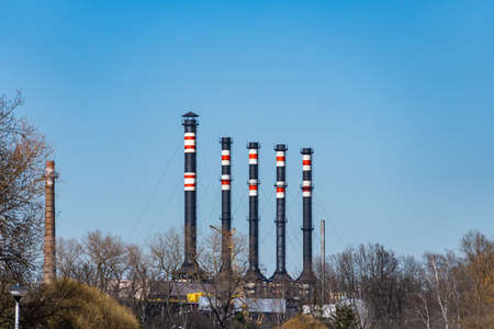 Factory with black chimneys on blue sky no smoke, industrial pipe of a factory, processing plantの写真素材