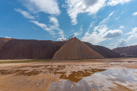Mining industry close up. Telestacker handles the ore closeup for potash waste heaps, extraction of...
