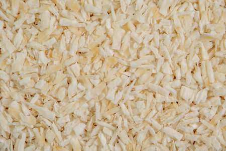 Fresh coconut flakes background. Coconut shavings or grated coconutの写真素材