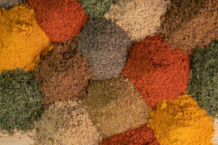 Heap different Asian Spices lies on wooden background. Spice and seasoning. Various fragrant spice market. Assortment spices and herbs for cookingの写真素材