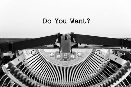 Do You Want phrase close up being typing and centered on a sheet of paper on old vintage typewriter mechanicalの写真素材