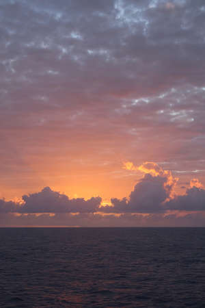 Majestic Sunset with a Golden Glow and the Cloudsの写真素材