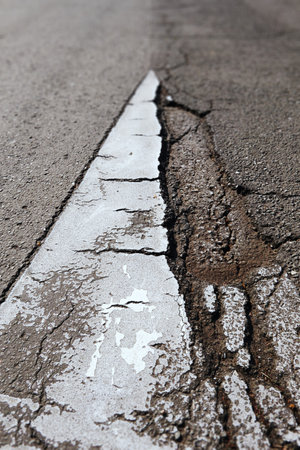 Road Sign Cracked White Arrowhead Closeupの写真素材