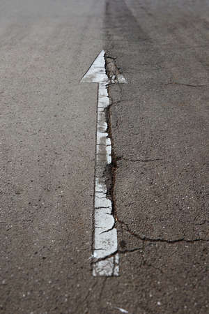 Road Sign Cracked White Arrow Fullの写真素材