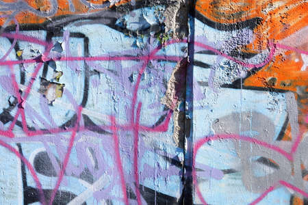 Damaged Concrete Wall and Graffiti Leftowersの写真素材
