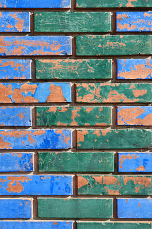 Painted Colorful Brick Wall Detail Aged with Blotchesの写真素材
