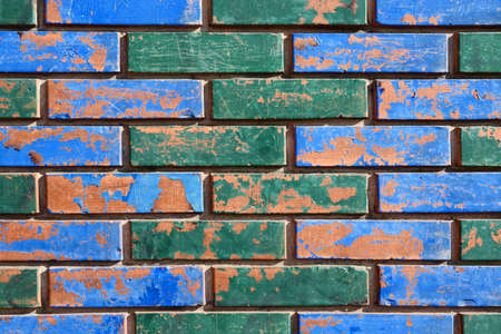 Painted Colorful Brick Wall Detail Aged with Blotchesの写真素材